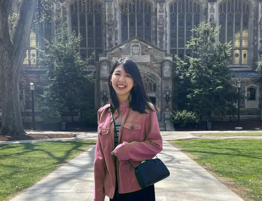 Grace Lee smiling outdoors on a college campus